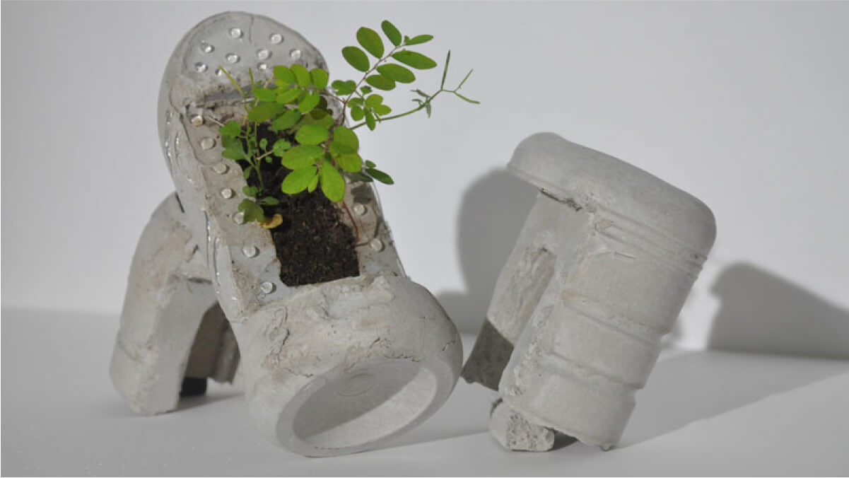 Concrete plastic bottle with plants