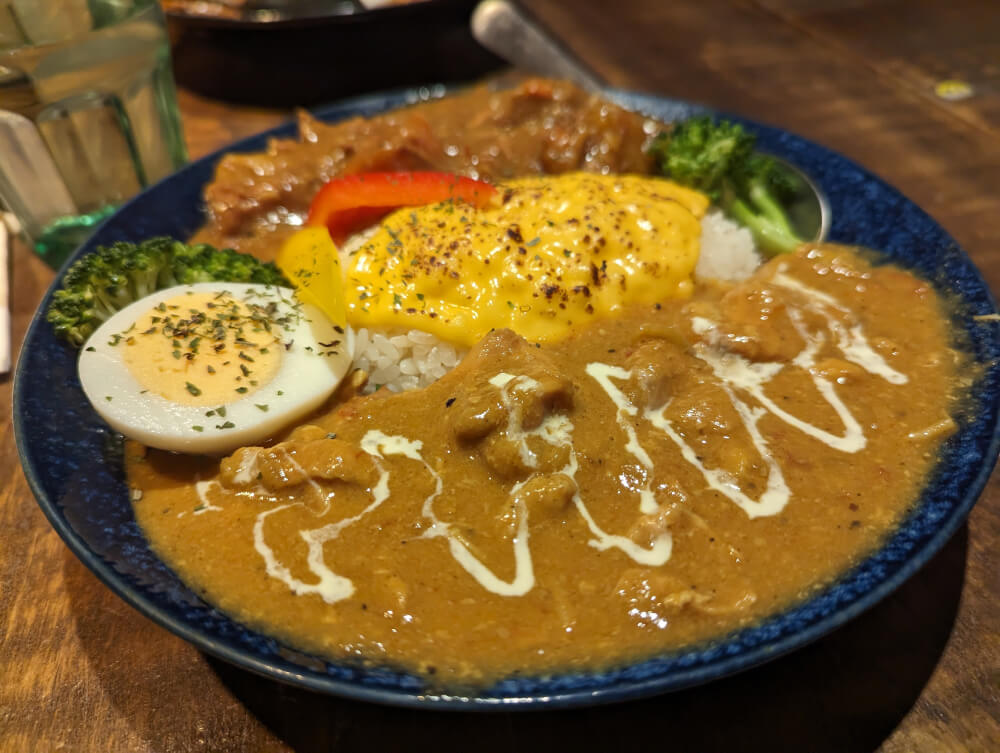 Curry served with cheese and egg